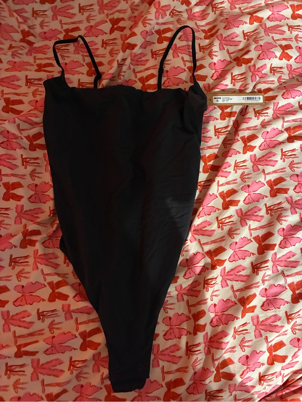 SKIMS Black One-Piece Bodysuit with Spaghetti Straps